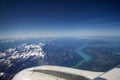 TURIN, ITALY - 13 SEP 2019: Aerial view above the clouds from a plane flying over the Swiss Alps, with mountain peaks Royalty Free Stock Photo