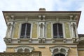 Art Nouveau building architecture with green floral decorations in Turin, Italy