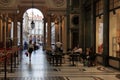 Turin, Italy - september 2020: a Caucasian woman goes shopping under the arcades of the San Federico gallery