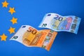 Close up of two flying Euros banknotes on a background of Euros banknotes Royalty Free Stock Photo