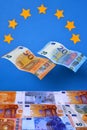 Close up of two flying Euros banknotes on a background of Euros banknotes Royalty Free Stock Photo