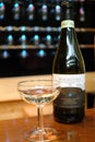 Turin, Piedmont, Italy. -10/26/2009- Fair `Wine show`, glass and bottle of sweet sparkling wine Moscato d`Asti.