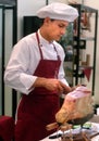 Turin, Piedmont/Italy - 10/22/2010- The Food Fair `Salone del Gusto`. Pork butcher cuts row ham.