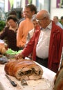 Turin, Piedmont/Italy - 10/22/2010- The Food Fair `Salone del Gusto`. Porchetta traditional italian roasted pork meat.