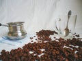 Turka for brewing coffee, a cup with a spoon and coffee beans