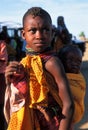 Turkana girl with child (Kenya) Royalty Free Stock Photo