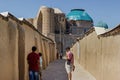 Tourists near the medieval Mausoleum of Khoja Ahmed Yasawi in the city of Turkestan, in southern Kazakhstan