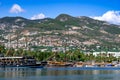 Coastline of Turkish town with sign I Love Alanya on the hill. Beautiful landscape with ships