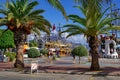 Tropical exotic promenade in Alanya Marina Alanya Yat Limani. Palm trees grow on the city