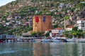 View of the Red Tower Kizil Kule from Mediterranean Sea in Alanya. Tourist cityscape with