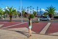 Young caucasian woman looks at pirate ships in Alanya Yat Limani port. Beautiful cityscape with Royalty Free Stock Photo