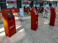 Turkish Airlines red self-service terminals at Ankara Esenboga Airport ESB. Row of check-in Royalty Free Stock Photo