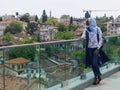 Turkey, Antalya, May 10, 2018. African young woman in beautiful clothes, headscarf and sunglasses standing on the viewing platform