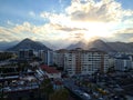 Turkey, Antalya. View from the hotel - evening landscape. The sun goes down behind the mountains and hides behind the clouds. Royalty Free Stock Photo