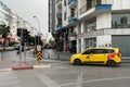 Turkey, Antalya - 11 11 2022: Yellow turkish taxi car with colourful bokeh of city street