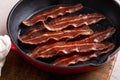 Turkey bacon cooked in a cast iron pan