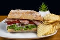 turkey with blt on ciabatta bread, and a side of chips Royalty Free Stock Photo