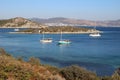 Traditional Turkish Gulet schooners and yachts moored at sea in calm waters of Aquarium Bay near Bodrum.