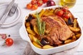 Turkey breast meat baked with potato wedges, red onion, tomatoes and rosemary