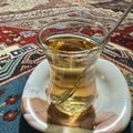 A glass of apple tea serviced to the guest in the cave house in Cappadocia, Turkey Royalty Free Stock Photo