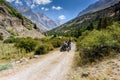 Turkey, Chamard - August 3, 2019: an elderly Turkish man drives an old tractor with a passenger on a road with a