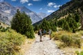 Turkey, Chamard - August 3, 2019: The guide shows tourists the direction of the road through the mountain landscape in