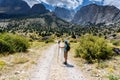 Turkey, Chamard - August 3, 2019: Tourist watchs around and stays on the road through the mountain landscape in the