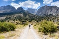 Turkey, Chamard - August 3, 2019: Tourists walk along the road through the mountain landscape in the Turkish national