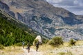 Turkey, Chamard - August 3, 2019: Tourists walk along the road through the mountain landscape in the Turkish national