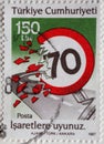 TURKEY - CIRCA 1987: a postage stamp printed in Turkey with a two-way traffic sign for speed limit for 70 km. Text: Obey the signs