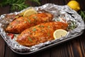 turkey cutlets coated in spicy marinade resting on aluminum foil