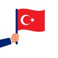 Turkey flag in hand. The patriot holds the national flag in hand.