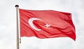 Turkish flag waving against cloudy sky background Royalty Free Stock Photo