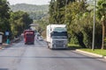 Heavy trucks drive on a highway in Turkey. Trucks rush along Turkish roads. Travel to Turkey.