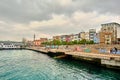 Karakoy shore and colorful painting on seating area and a man waiting for fishing