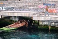 Karakoy shore and colorful painting on seating area and a man waiting for fishing Royalty Free Stock Photo