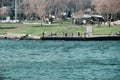 Many people near shore of bosphorus istanbul by taking photo from pedestrian ferry Royalty Free Stock Photo