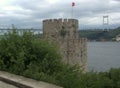 Turkey, Istanbul, Rumeli Hisari castle, view of the Halil Pasha Tower and the Fatih Sultan Mehmet Bridge Royalty Free Stock Photo