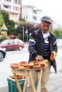 Turkey, Istanbul 10.22.2016 - Turkish man sells simits on the street