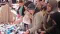 Women shoppers in the Istanbul street market choose goods