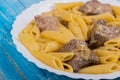 Turkey liver with pasta on a plate Royalty Free Stock Photo