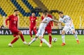 Turkey national football team striker Kenan Karaman against Russia players Anton Zabolotny and Alexey Miranchuk during UEFA