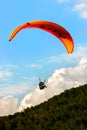 Turkey, Oludeniz - June 23, 2015: The flight of paragliders in the highlands. Paragliding