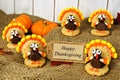 Turkey shaped cookies with Happy Thanksgiving card on burlap Royalty Free Stock Photo