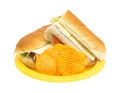 Turkey sub sandwich with chips on yellow plate Royalty Free Stock Photo