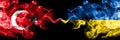 Turkey vs Ukraine, Ukrainian smoke flags placed side by side. Thick colored silky smoke flags of Turkish and Ukraine, Ukrainian