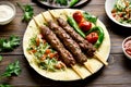 Turkish Adana Kebab with fresh vegetables on flatbread Royalty Free Stock Photo