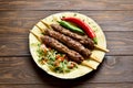 Turkish Adana Kebab with fresh vegetables on flatbread Royalty Free Stock Photo