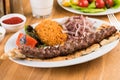 Turkish Adana Kebab with Vegetables on wooden table