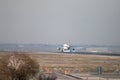 Turkish Airlines jet airliner approach to land at Madrid airport runway, seen from behind